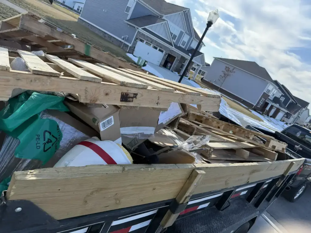 Dump trailer loaded for a junk haul in a subdivision