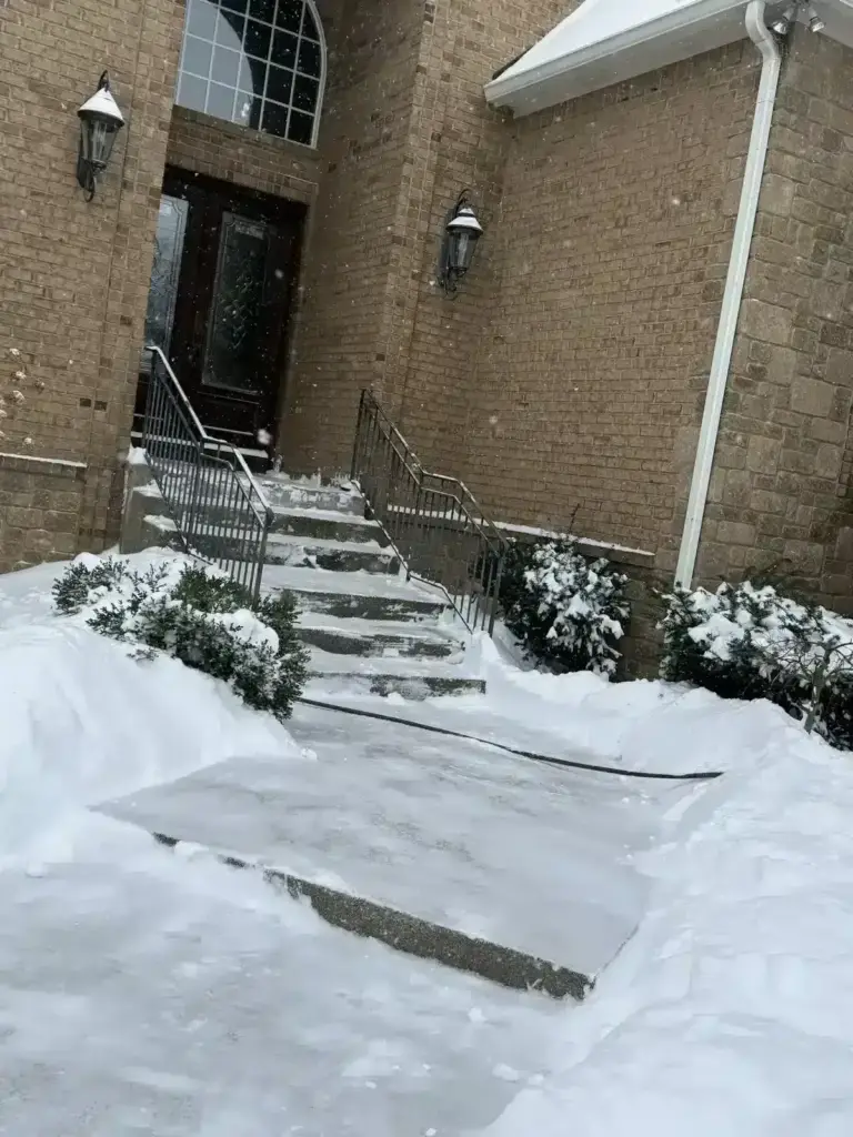 Salted front steps and walkway after a snow