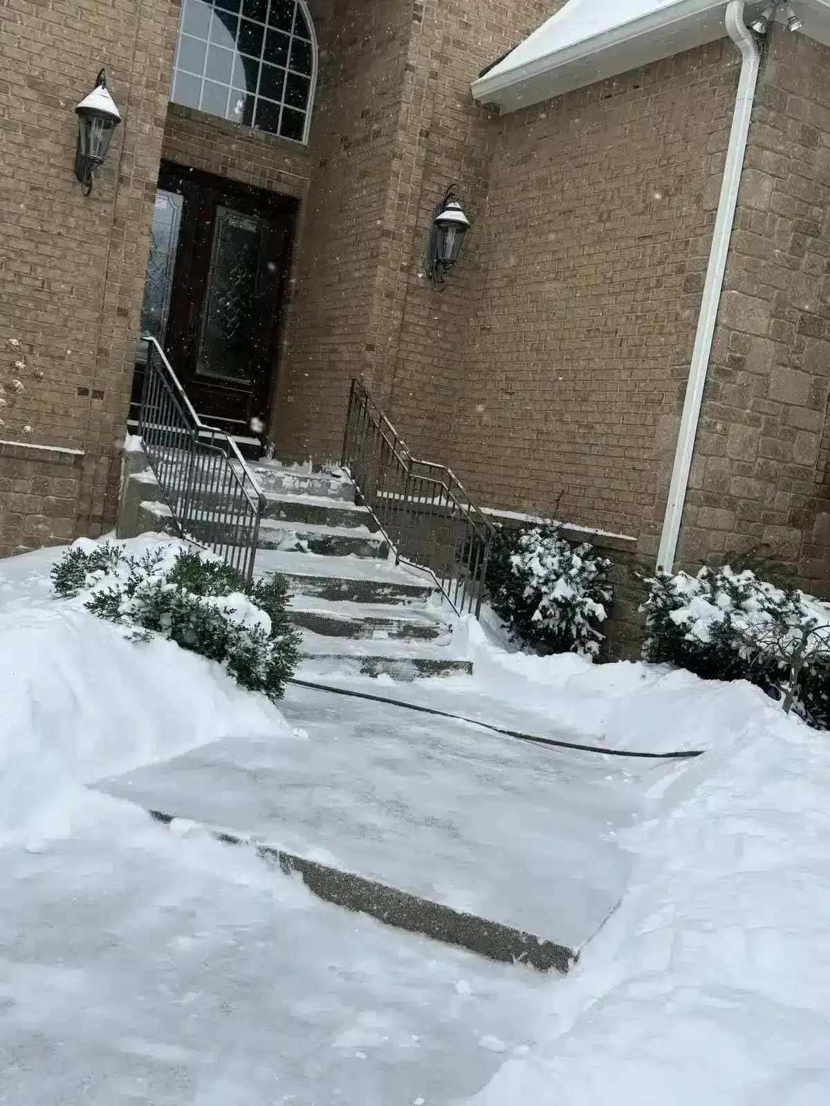 Salted front steps and walkway after a snow in Carmel, IN